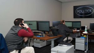 males behind computer monitors monitored IT services